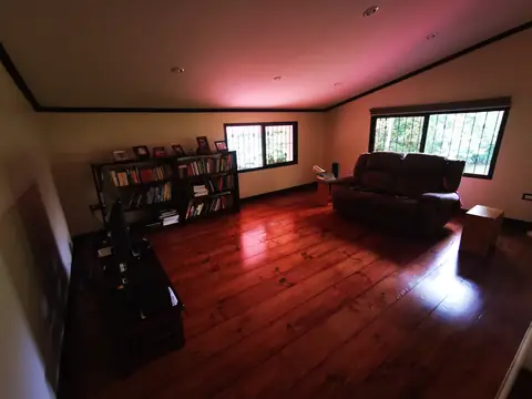 The living room with its wooden floor — Main house, Rio Ángel Bio-reserve