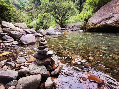 A stone cairn in the river — Waterfalls and rivers, Rio Ángel Bio-reserve