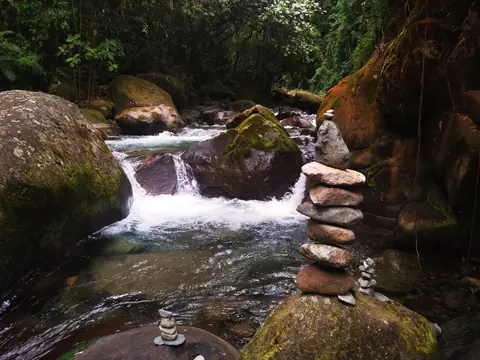 Cairns by the rapids — Waterfalls and rivers, Rio Ángel Bio-reserve